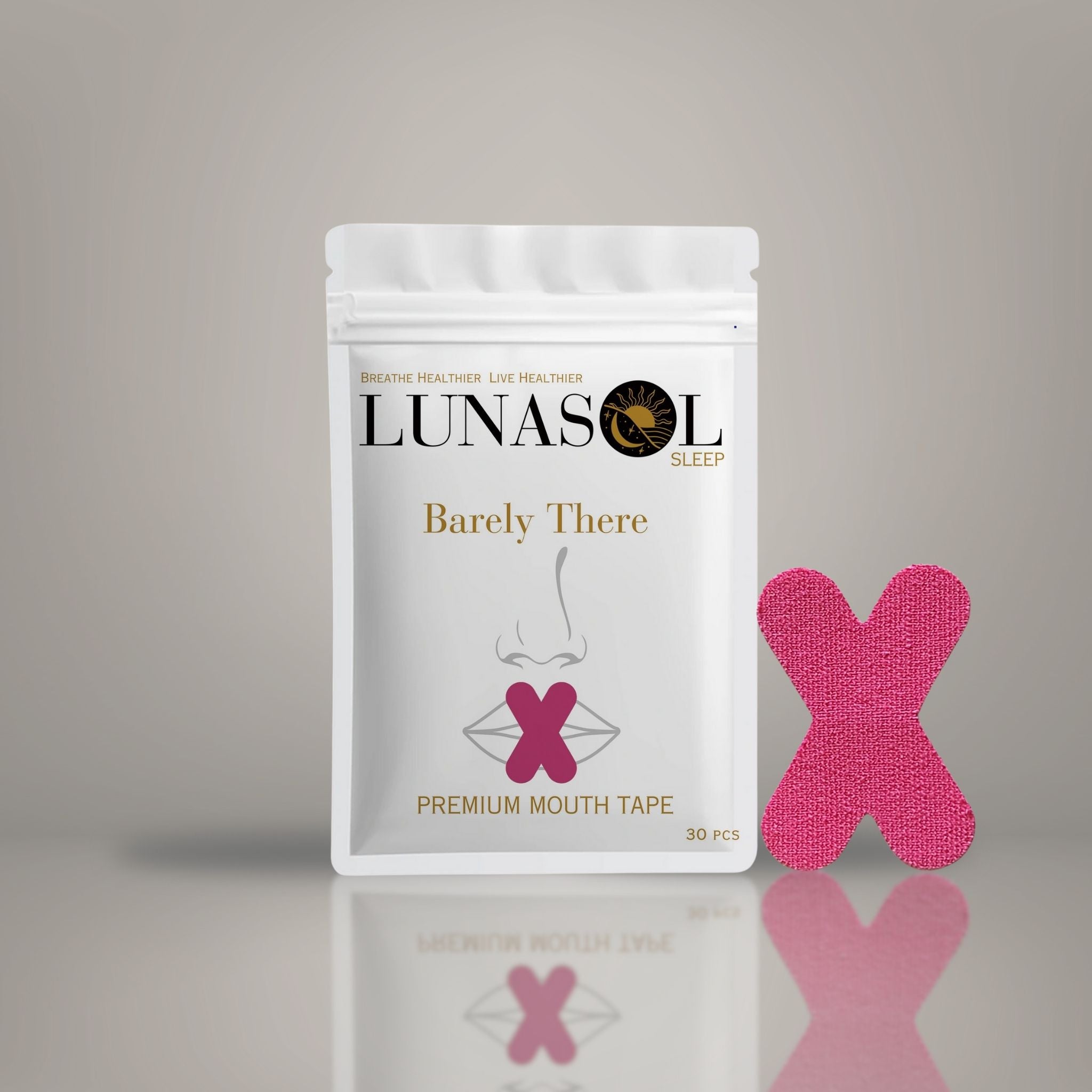 A Lunasol Sleep Barely There Mouth Tape bag in Sunset Pink displayed with one piece next to it, designed to encourage nasal breathing for improved sleep quality and overall health.