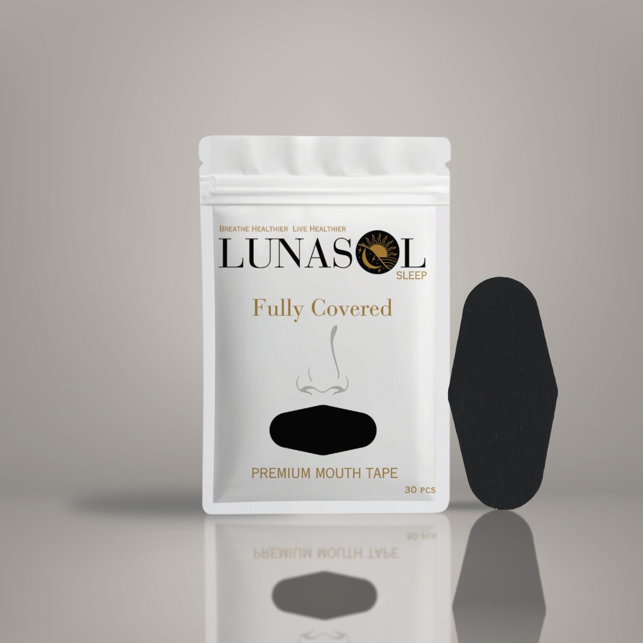 A Lunasol Sleep Fully Covered Mouth Tape bag in Eclipse Black displayed with one piece standing next to it, designed to promote full nasal breathing for optimal sleep and health benefits.